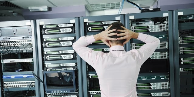 it business man in network server room have problems and looking for  disaster situation  solution-591452-edited.jpeg